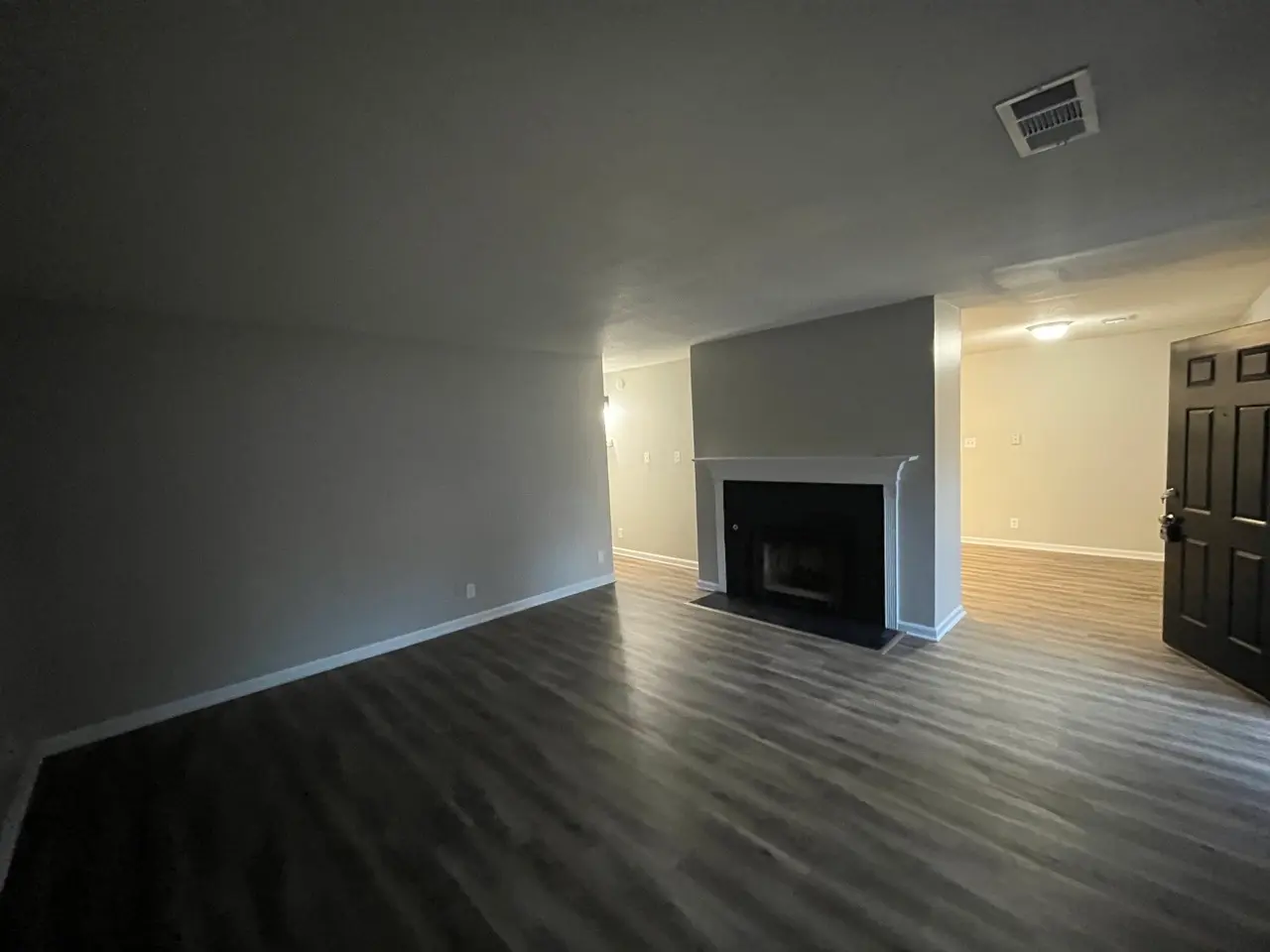 Living room after: fresh gray walls and white trim